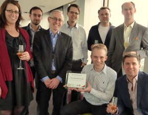 The team celebrates the award